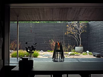 EcoSmart Fire Stix Fire Pit brings contemporary outdoor ambience and clean-burning ethanol warmth to a private residence.