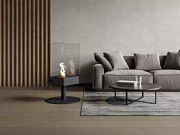EcoSmart Fire Orbit Designer Fireplace showcases a freestanding bioethanol centrepiece in an indoor private residence living room.