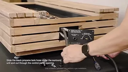 Routing the black propane hose through the control panelopening